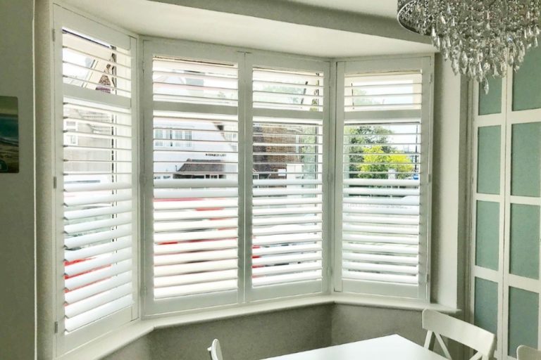 Plantation shutters for bay windows